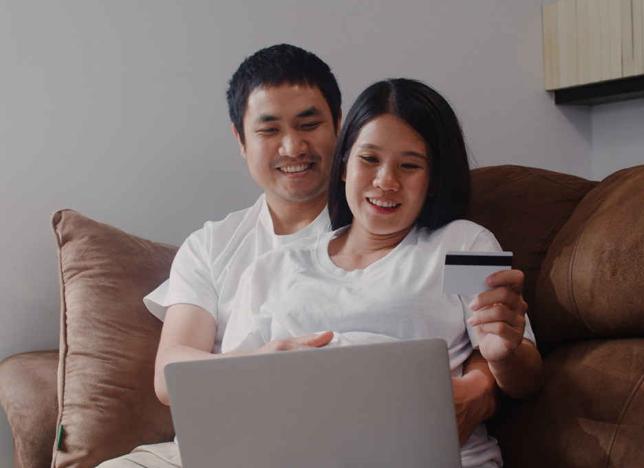 Young Asian Pregnant Couple Online Shopping Home Mom Dad Feeling Happy Using Laptop Technology Credit